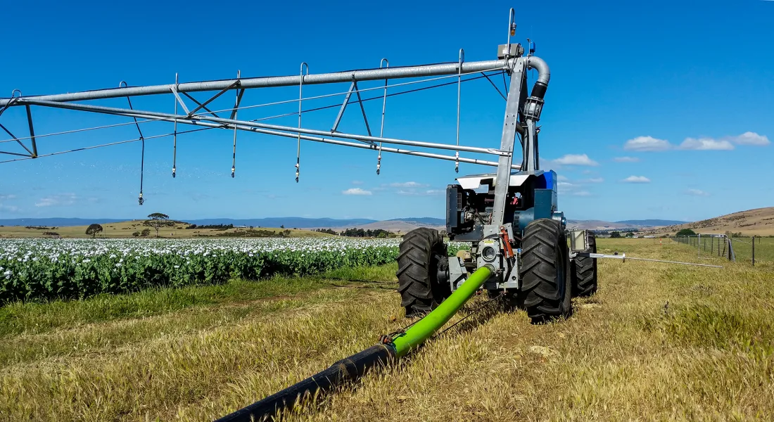 Reinke hose-fed lateral move power tower in a field